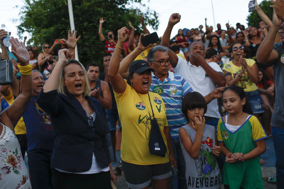 Supporters of former lawmaker Roberto Jefferson protest against his arrest next to his house in Levy Gasparian, Rio de Janeiro state, Brazil, Sunday, Oct. 23, 2022. Jefferson, an ally of Brazilian President Jair Bolsonaro, fired gunshots and a grenade at federal policemen who tried to arrest him in for insulting supreme court ministers, according to Brazil’s federal police. (AP Photo/Bruna Prado)