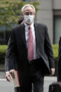 Former Nissan Motor Co. executive Greg Kelly arrives for the first trial hearing at the Tokyo District Court in Tokyo Tuesday, Sept. 15, 2020. The financial misconduct trial of Kelly opened Tuesday. Japanese prosecutors outlined allegations of what they said was a complex and clandestine scheme to pay former star executive Carlos Ghosn. (Kiyoshi Ota/Pool Photo via AP)