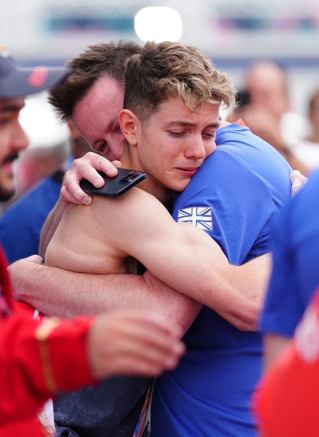 Toby Roberts celebrated by hugging family members