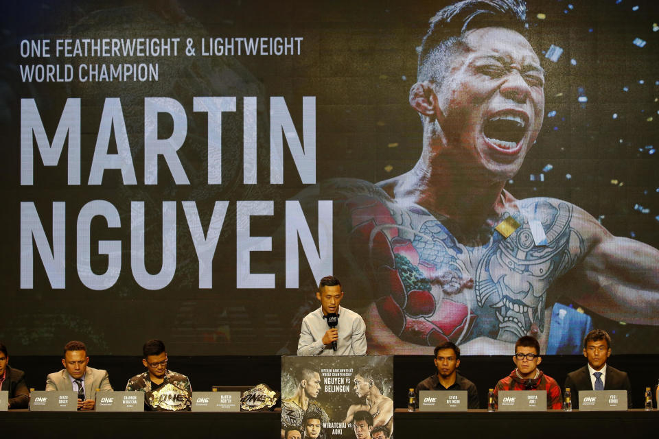 FILE - In this July 24, 2018, file photo, reigning ONE featherweight and lightweight world champion Martin Nguyen addresses reporters during a news conference for the ONE Championship mixed martial arts event in Pasay city, south of Manila, Philippines. One Championship, the MMA organization out of Asia, is going global in 2019 and it's making the kind of moves that shows it plans to become a player in combat sports. (AP Photo/Bullit Marquez, File)