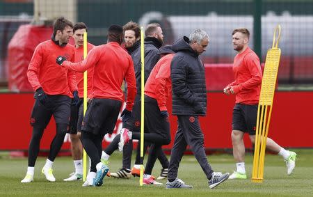 Britain Football Soccer - Manchester United Training - Manchester United Training Ground - 12/4/17 Manchester United's manager Jose Mourinho with Luke Shaw and teammates during training Action Images via Reuters / Ed Sykes Livepic