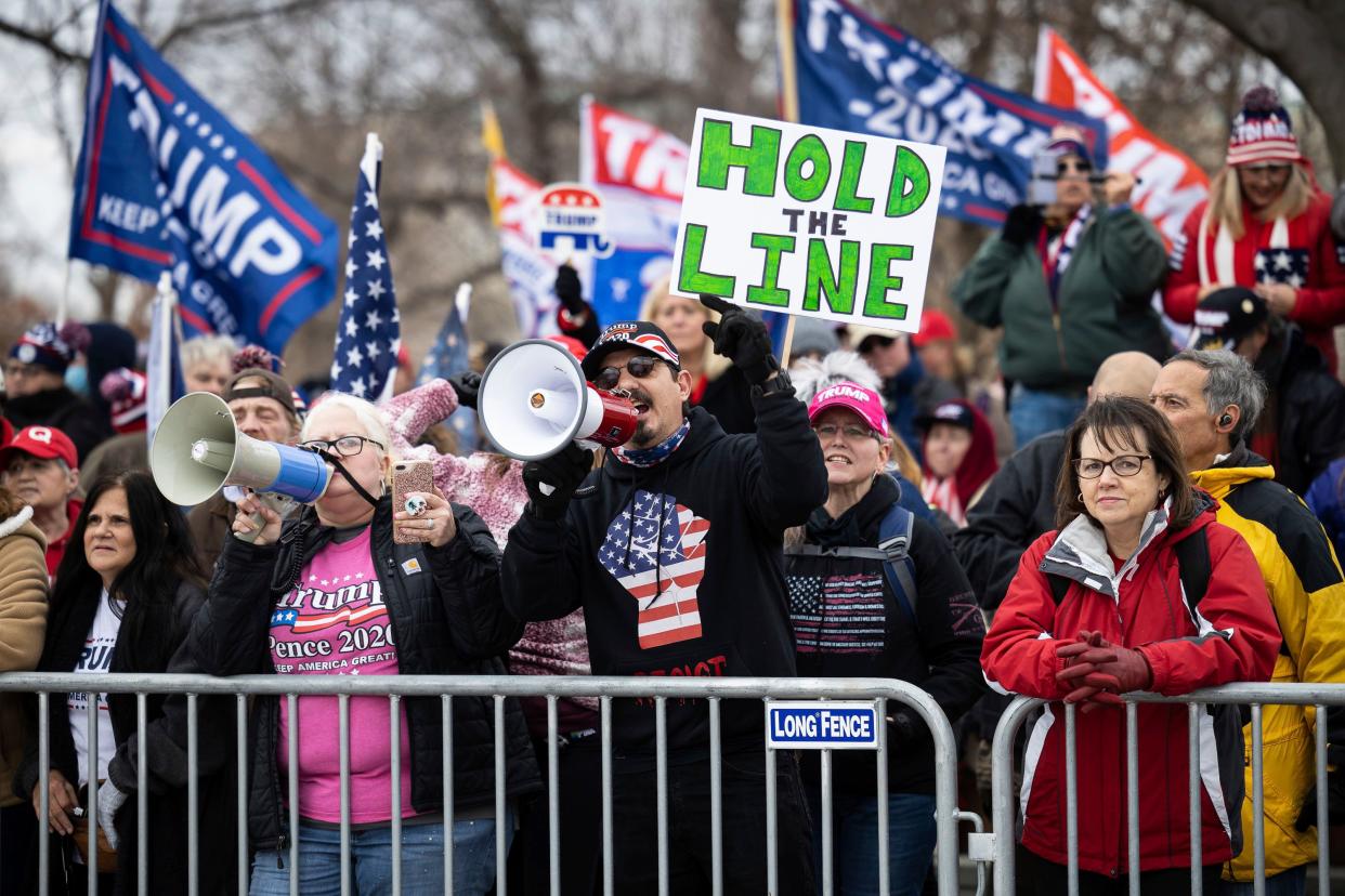 Supporters of President Donald Trump gather behind a police barricade on the east plaza of the U.S. Capitol onJan. 6 to protest the certification of President-elect Biden's Electoral  College victory. (Photo: Francis Chung/E&E News and Politico via AP Images)