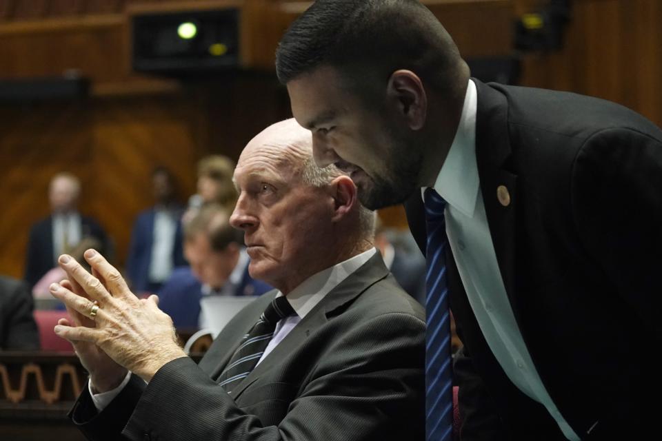 Rep. Andrés Cano, D-Tucson, right, speaks with Arizona House Speaker Rusty Bowers, R-Mesa, during a vote on the Arizona budget Thursday, June 24, 2021, in Phoenix. (AP Photo/Ross D. Franklin)