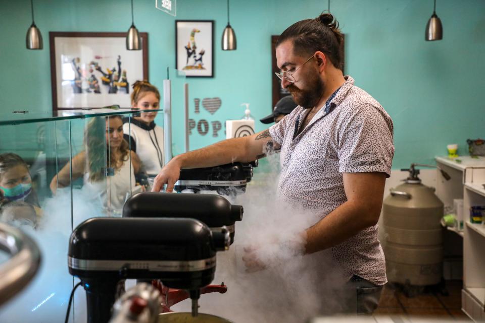 Store manager Juan Martin prepares ice cream for customers at Nitro Infusions, Saturday, Sept. 4, 2021, in La Quinta. 