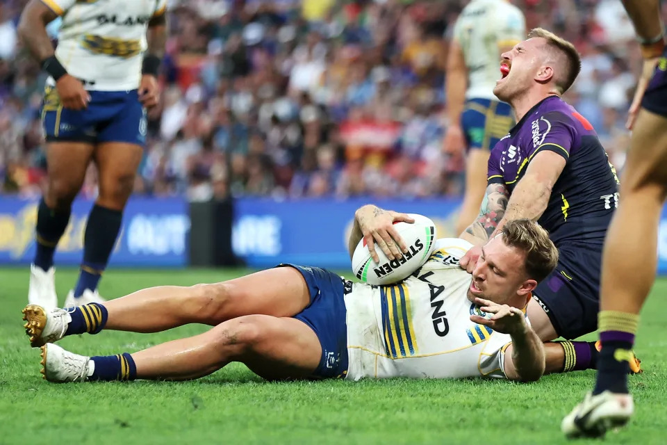 BRISBANE, AUSTRALIA - MAY 19: Cameron Munster of the Storm reacts to an injury during the round 11 NRL match between Melbourne Storm and Parramatta Eels at Suncorp Stadium, on May 19, 2024, in Brisbane, Australia. (Photo by Hannah Peters/Getty Images)