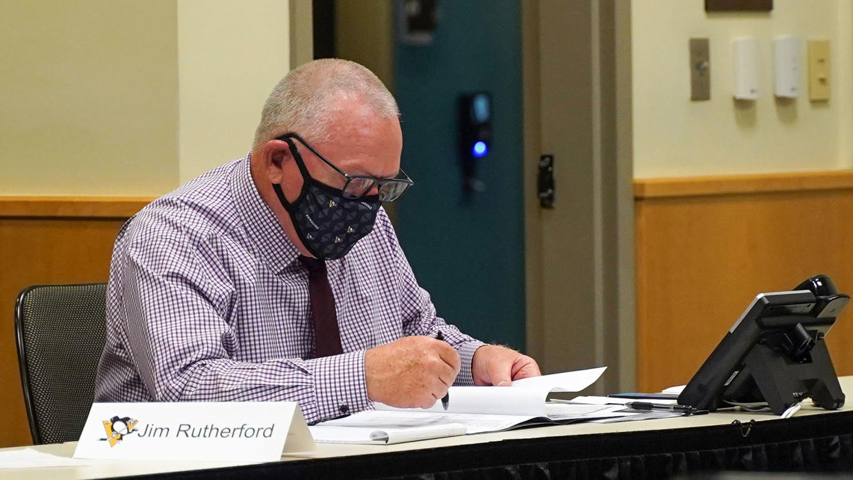 PITTSBURGH, PENNSLYVANIA- OCTOBER 07: General manager Jim Rutherford of the Pittsburgh Penguins sits at the draft table during rounds 2-7 of the 2020 NHL Entry Draft at PPG Paints Arena on October 07, 2020 in Pittsburgh, Pennsylvania. The 2020 NHL Draft was held virtually due to the ongoing Coronavirus pandemic. (Photo by Ryan Yorgen/NHLI via Getty Images)