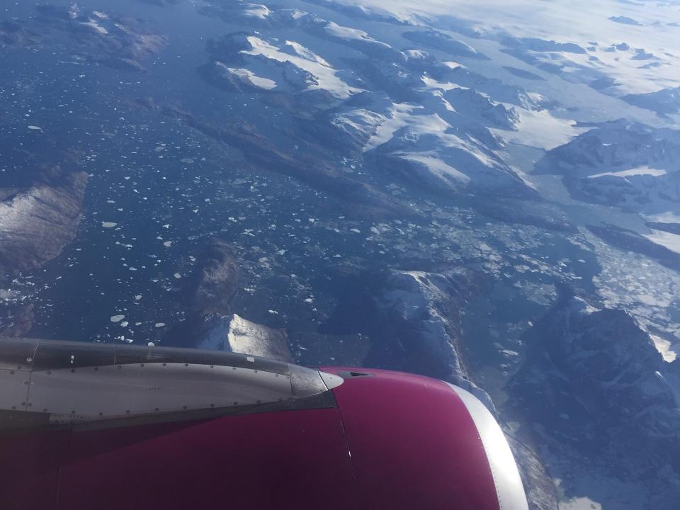 An aerial view of Greenland from inside the plane.