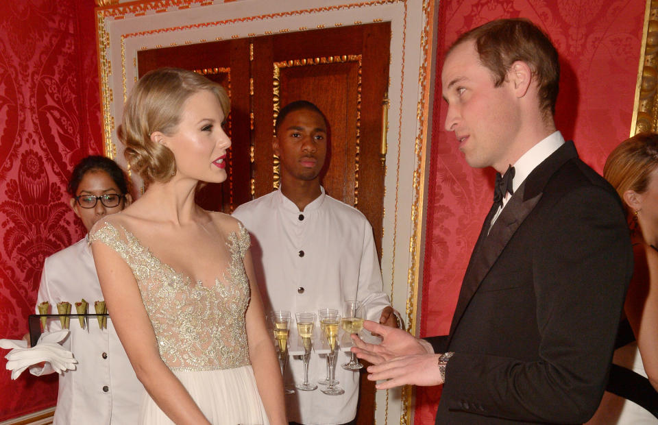 LONDON, ENGLAND - NOVEMBER 26:  Prince William, Duke of Cambridge meets singer Taylor Swift at Kensington Palace for the Centrepoint Winter Whites Gala on November 26, 2013 in London, England.  (Photo by Dominic Lipinski - WPA Pool/Getty Images)