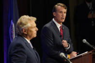 Republican gubernatorial candidate Glenn Youngkin, right, gestures as Democratic gubernatorial candidate and former governor Terry McAuliffe, left, looks on during a debate at the Appalachian School of Law in Grundy, Va., Thursday, Sept. 16, 2021. (AP Photo/Steve Helber)