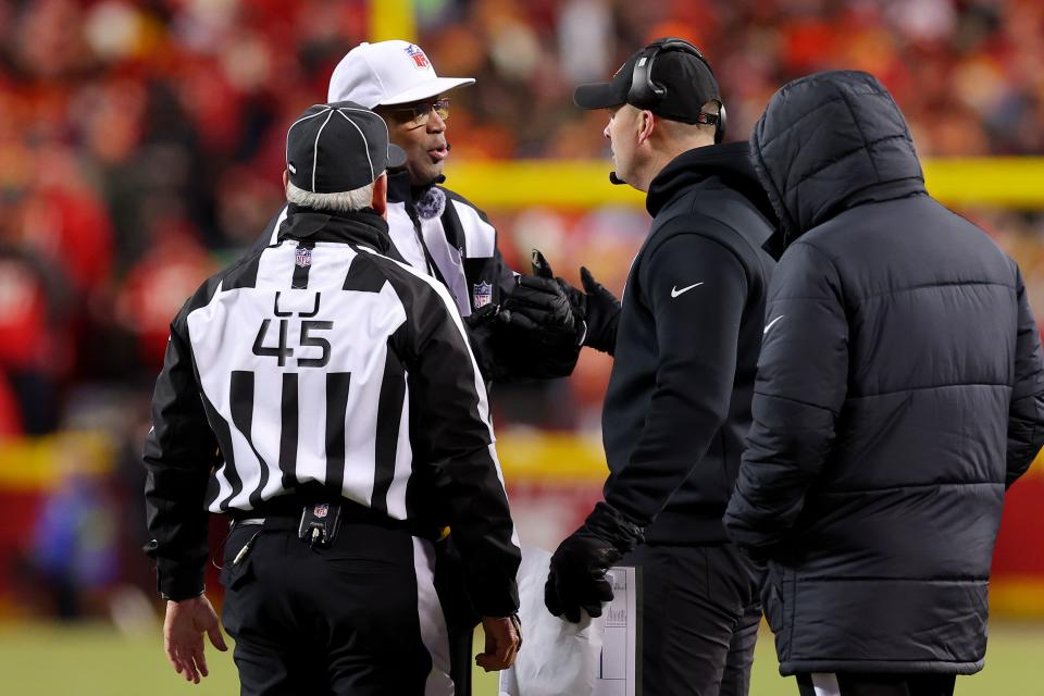 KANSAS CITY, MISSOURI - JANUARY 29: Head coach Zac Taylor of the Cincinnati Bengals (R) talks with referee Ronald Torbert #62 and line judge Jeff Seeman #45 (L) during the second half against the Kansas City Chiefs in the AFC Championship Game at GEHA Field at Arrowhead Stadium on January 29, 2023 in Kansas City, Missouri. (Photo by Kevin C. Cox/Getty Images)