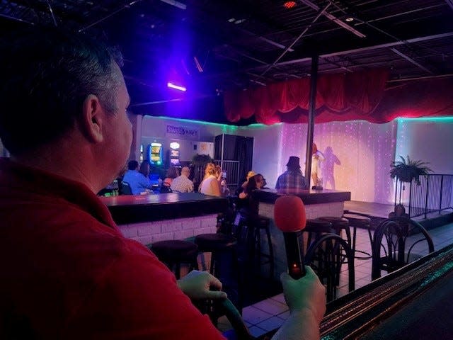 Clarence Denenea begins a Friday night at his Houma bar, Androgyny, whose entertainment lineups include drag shows. He says recent hostility toward drag performers in various states has negatively impacted his business.