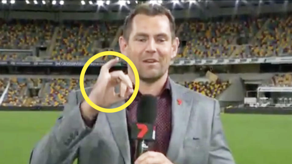 AFL legend Luke Hodge shows his right pinky finger during an interview.