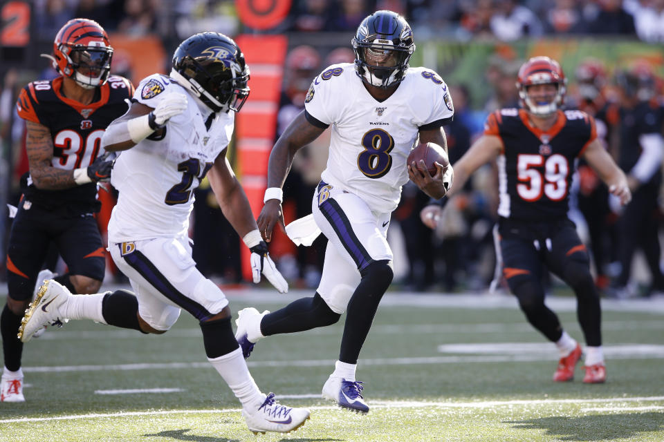 Baltimore Ravens quarterback Lamar Jackson (8) runs the ball for a touchdown during the second half of NFL football game against the Cincinnati Bengals, Sunday, Nov. 10, 2019, in Cincinnati. (AP Photo/Gary Landers)