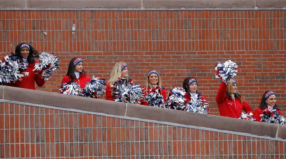 New England Patriots cheerleaders perform during a send off rally for the team outside City Hall in Boston