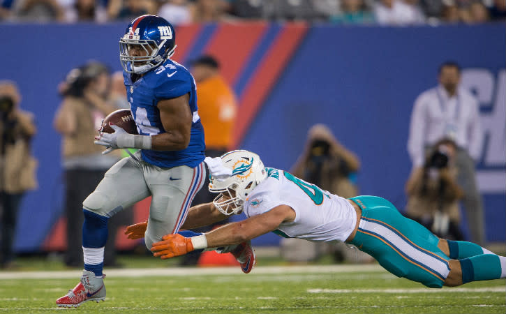 Aug 12, 2016; East Rutherford, NJ, USA;Miami Dolphins linebacker Kiko Alonso (47) tries to tackle New York Giants running back Shane Vereen (34) in the first half at MetLife Stadium. Mandatory Credit: William Hauser-USA TODAY Sports