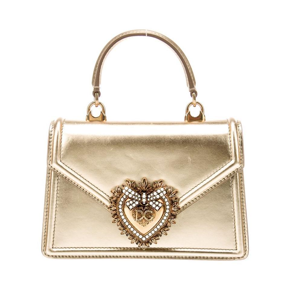 <p><a href="https://go.redirectingat.com?id=74968X1596630&url=https%3A%2F%2Fwww.therealreal.com%2Fproducts%2Fwomen%2Fhandbags%2Fhandle-bags%2Fdolce-gabbana-leather-devotion-handle-bag-jy4cc&sref=https%3A%2F%2F" rel="nofollow noopener" target="_blank" data-ylk="slk:Shop Now;elm:context_link;itc:0;sec:content-canvas" class="link ">Shop Now</a></p><p>Leather Devotion Handle Bag</p><p>therealreal.com</p><p>$1395.00</p>