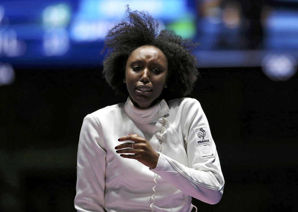 <p>Lauren Rembi of France reacts after losing a bronze medal fencing bout at Carioca Arena in Rio on August 6, 2016. (REUTERS/Issei Kato) </p>