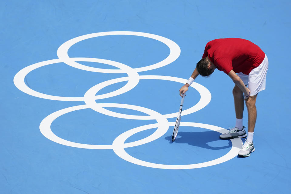 Daniil Medvedev, of the Russian Olympic Committee, pauses during a third round men's tennis match against Fabio Fognini, of Italy, at the 2020 Summer Olympics, Wednesday, July 28, 2021, in Tokyo, Japan. (AP Photo/Patrick Semansky)