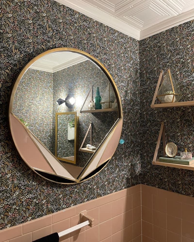 Brass mirror in newly renovated bathroom