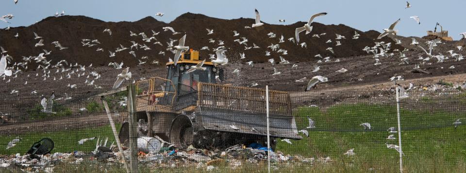 Machines move garbage Monday, July 8, 2019, at the Muskegon County Municipal Landfill in Ravenna. Michigan hasn't built a new landfill in more than two decades. That's not likely to change dramatically as new laws supported by the administration of Gov. Gretchen Whitmer make it tougher than ever to build new facilities.