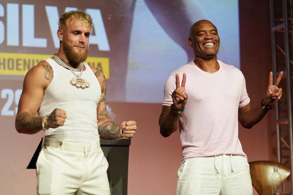 FILE - Jake Paul, left, and Anderson Silva pose for photos during a news conference Monday, Sept. 12, 2022, in Los Angeles. Paul is the biggest name on the growing list of social media influencers improbably leveraging their fame into professional boxing careers. The YouTube star has become a bankable attraction on Showtime pay-per-view shows less than three years after he started training in earnest. He will fight Silva on Saturday, Oct. 29, 2022, in Glendale, Arizona. (AP Photo/Ashley Landis, File)