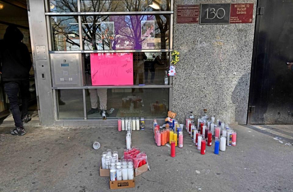 A memorial was set up outside the victim’s apartment building in Wyckoff Gardens on Sunday. Gregory P. Mango