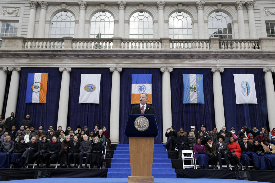 FILE- In this Jan. 1, 2014 file photo, New York City Mayor Bill de Blasio speaks after being sworn in during the public inauguration ceremony at City Hall in New York. Hours after taking his official oath of office in front of his home in an informal setting, the media-savvy mayor arrived for his formal inauguration on the steps of New York City Hall by subway. (AP Photo/Seth Wenig, File)