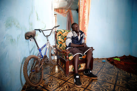 Mafu Hydara, a Gambian migrant who voluntarily returned from Libya, sits during an interview at his home in Brikama, Gambia April 6, 2017. REUTERS/Luc Gnago