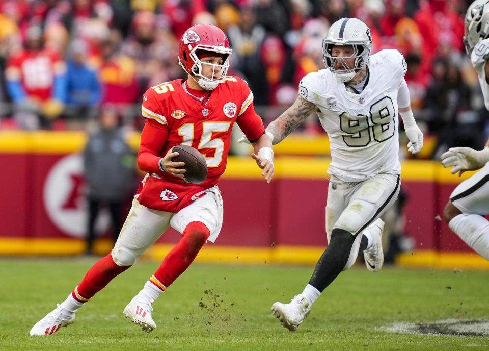 Dec 25, 2023; Kansas City, Missouri, USA; Kansas City Chiefs quarterback <a class="link " href="https://sports.yahoo.com/nfl/players/30123" data-i13n="sec:content-canvas;subsec:anchor_text;elm:context_link" data-ylk="slk:Patrick Mahomes;sec:content-canvas;subsec:anchor_text;elm:context_link;itc:0">Patrick Mahomes</a> (15) scrambles against Las Vegas Raiders defensive end <a class="link " href="https://sports.yahoo.com/nfl/players/31938" data-i13n="sec:content-canvas;subsec:anchor_text;elm:context_link" data-ylk="slk:Maxx Crosby;sec:content-canvas;subsec:anchor_text;elm:context_link;itc:0">Maxx Crosby</a> (98) during the second half at GEHA Field at Arrowhead Stadium. Mandatory Credit: Jay Biggerstaff-USA TODAY Sports