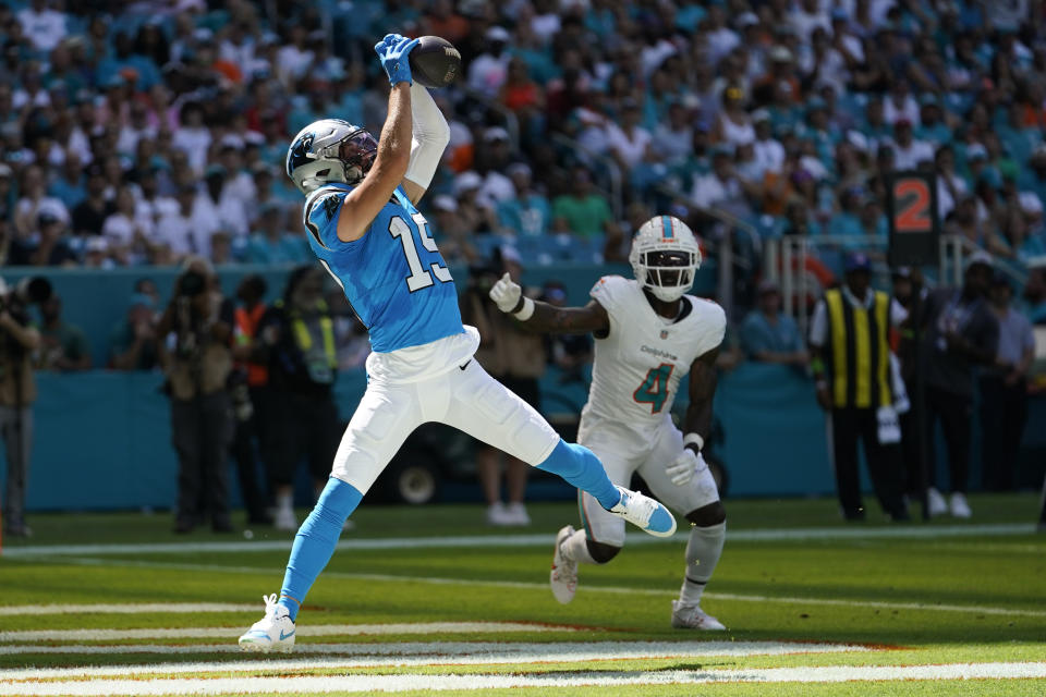 Carolina Panthers wide receiver Adam Thielen (19) catches a pass for a touchdown during the first half of an NFL football game against the Miami Dolphins, Sunday, Oct. 15, 2023, in Miami Gardens, Fla. (AP Photo/Lynne Sladky)