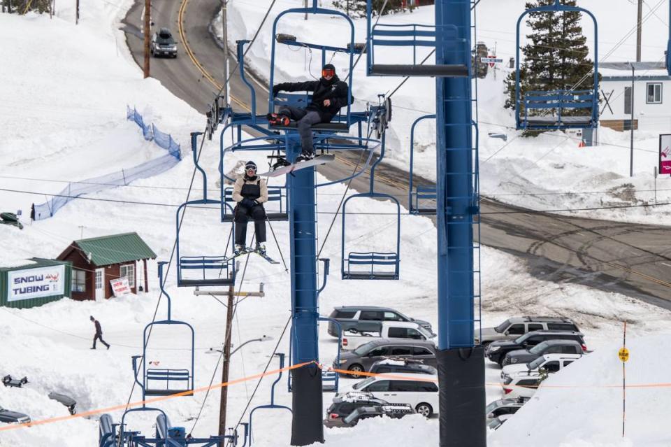 Felipe Mitre, right, takes a ride on a lift at Donner Ski Ranch earlier this month. Hector Amezcua/hamezcua@sacbee.com