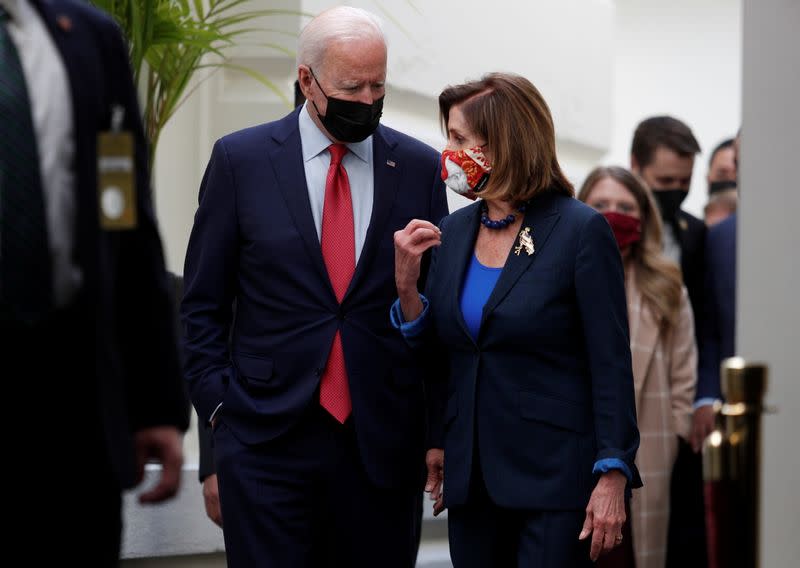 U.S. President Joe Biden talks with Speaker Pelosi after meeting with Democratic lawmakers to promote his bipartisan infrastructure bill at U.S. Capitol in Washington
