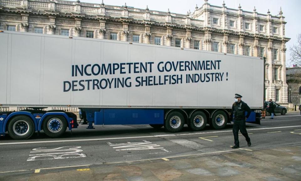 A slogan on one of the trucks says: 'Incompetent government destroying shellfish industry'