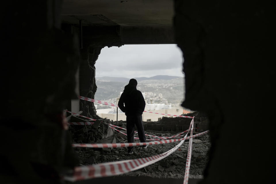 Palestinians inspect the apartment of Moaz al-Masry after it was demolished by the Israeli army in the West Bank city of Nablus, Monday, March 4, 2024. Israeli security forces blew up the home of al-Masry, a Palestinian accused of killing a British-Israeli woman and her two daughters in the West Bank last year. (AP Photo/Majdi Mohammed)