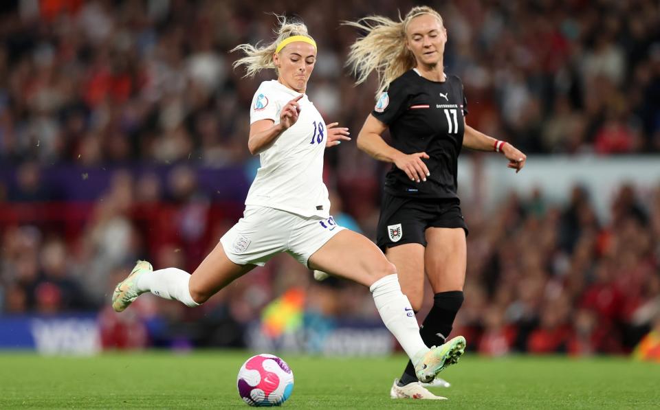 Chloe Kelly of England shoots whilst under pressure from Sarah Puntigam of Austria - GETTY IMAGES