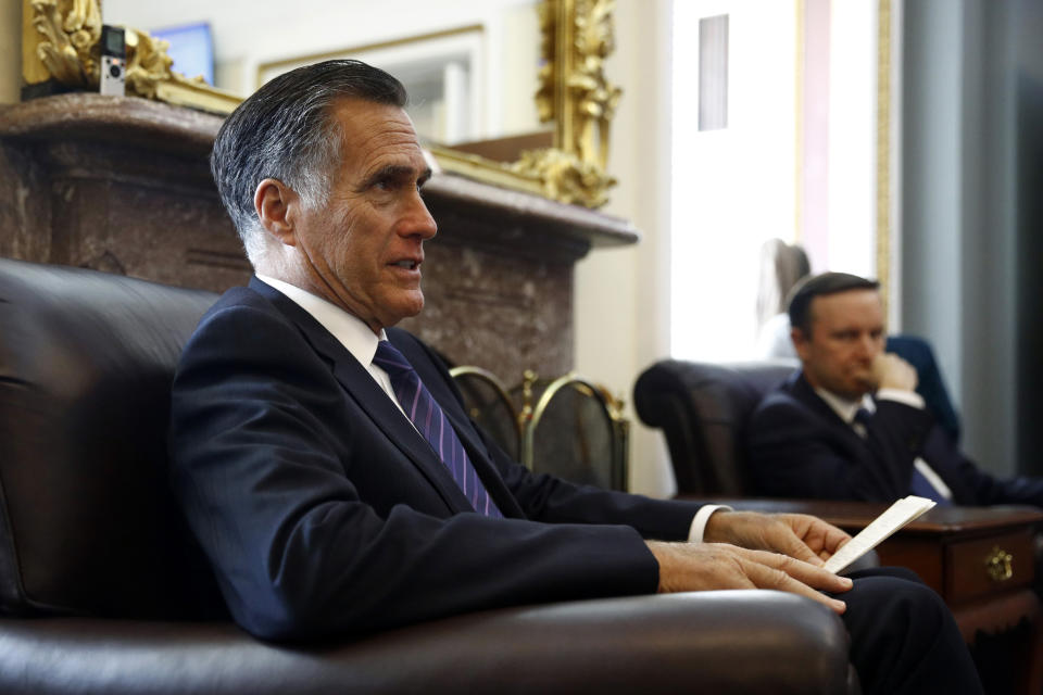 Sen. Mitt Romney, R-Utah, speaks with reporters alongside Sen. Chris Murphy, D-Conn., about their recent congressional delegation trip to the Middle East, Tuesday, April 30, 2019, inside the Senate Press Gallery on Capitol Hill in Washington. (AP Photo/Patrick Semansky)