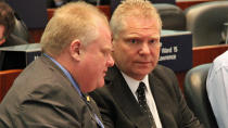 Toronto Mayor Rob Ford, left, and his brother, Coun. Doug Ford, are set to host a backyard barbecue for thousands of Torontonians.