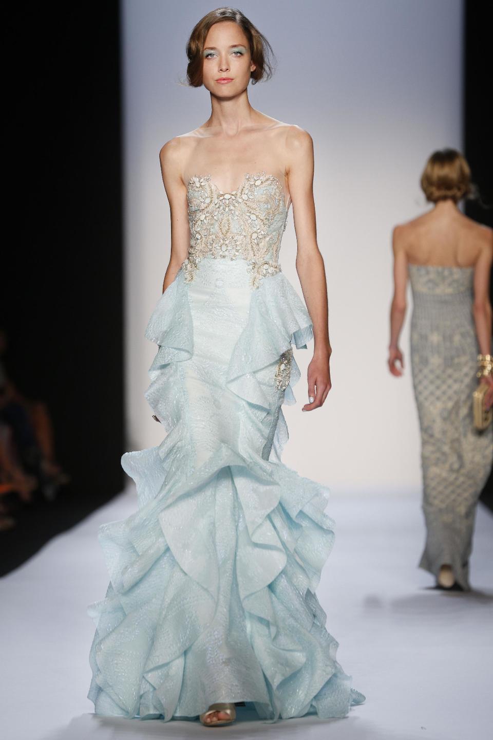 The Badgley Mischka Spring 2014 collection is modeled during Fashion Week in New York, Tuesday, Sept. 10, 2013. (AP Photo/John Minchillo)