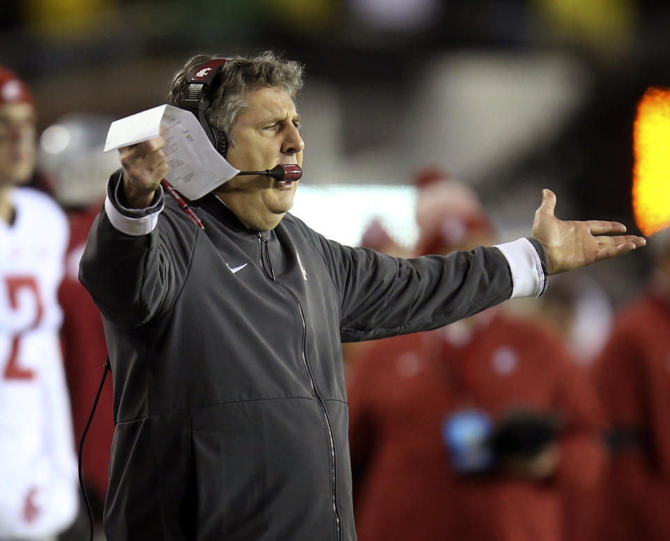 Washington State head football coach Mike Leach gestures to his team after a penalty call during the second quarter of an NCAA college football game against Oregon, Saturday, Oct. 26, 2019, in Eugene, Ore. (AP Photo/Chris Pietsch)