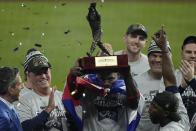 Atlanta Braves designated hitter Jorge Soler holds up the MVP trophy after winning baseball's World Series in Game 6 against the Houston Astros Tuesday, Nov. 2, 2021, in Houston. The Braves won 7-0. (AP Photo/Ashley Landis)