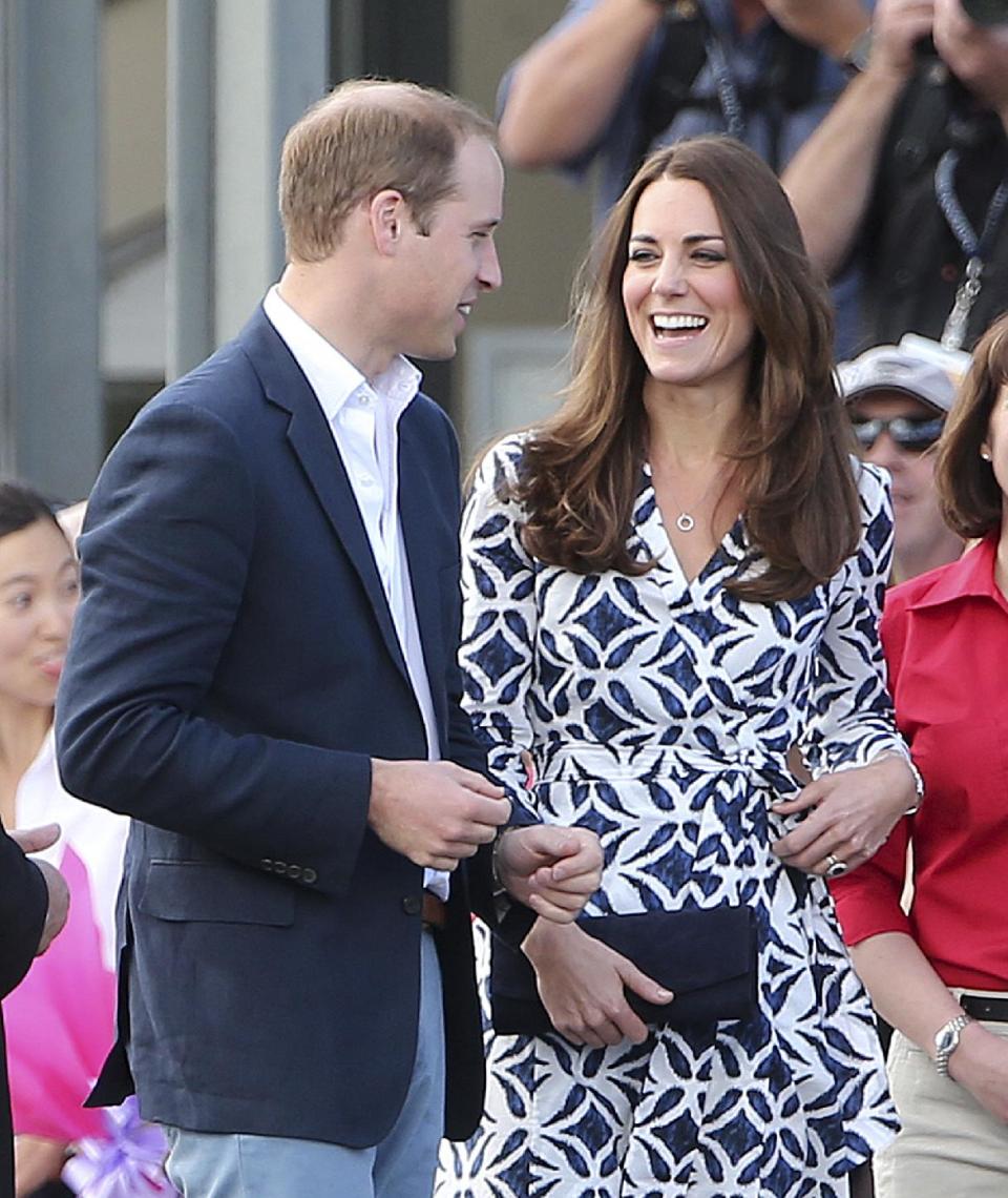 Britain's Kate, the Duchess of Cambridge smiles as she looks at her husband Prince William as they arrive at Echo Point Lookout in Katoomba, Australia, Thursday, April 17, 2014. The Duke and Duchess of Cambridge on Thursday stopped in the Blue Mountains town of Winmalee to meet with firefighters and locals affected by last year's wildfires that destroyed more than 200 homes. (AP Photo/Rob Griffith)