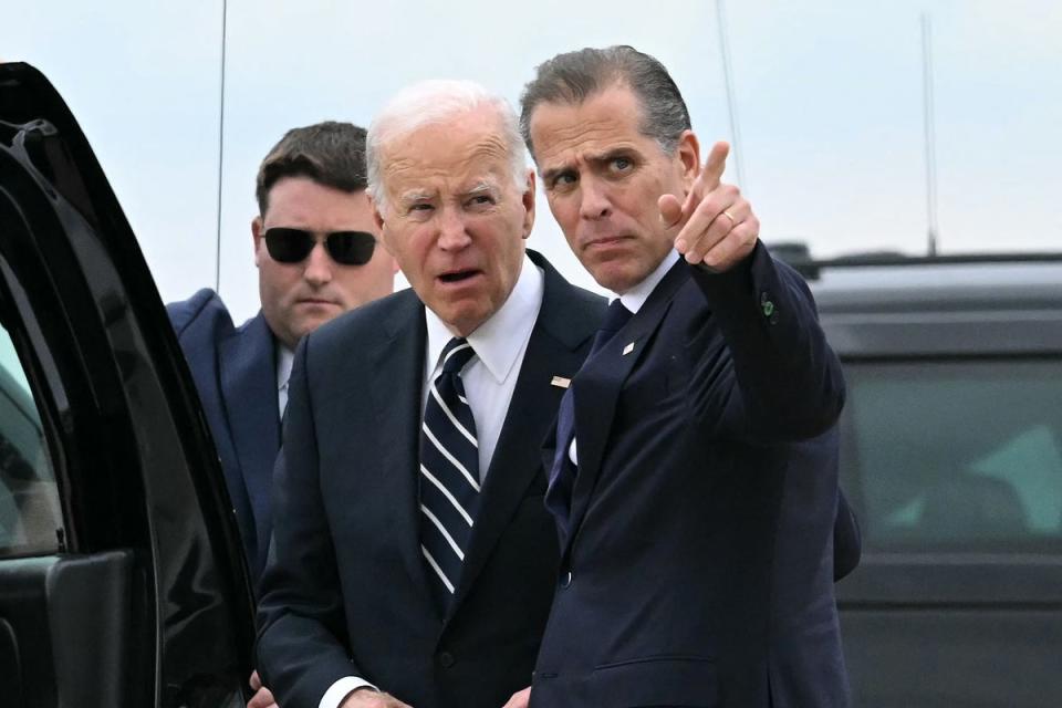 President Joe Biden has said he will not pardon his son after his gun convcition. The two are seen together in Delaware hours after a jury found the first son guilty of three felonies. (AFP via Getty Images)