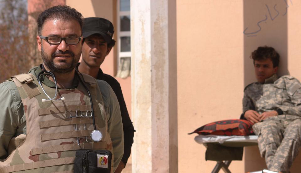 Head Doctor at the frontline clinic near Tal Afar, receiving patients, civilians and soldiers from the battlefield. (Photo: Ash Gallagher for Yahoo News)