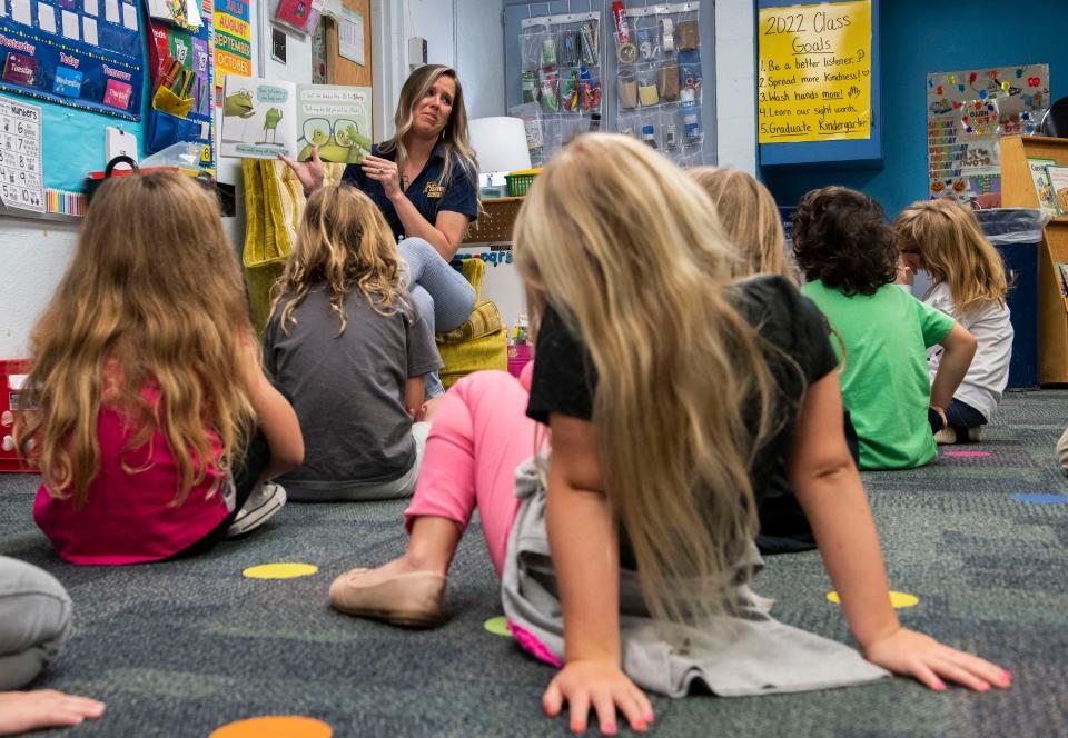 Gulf Breeze Elementary School teacher Rebecca Royal reads to her class of kindergartners in this March 23, 2022, file photo.