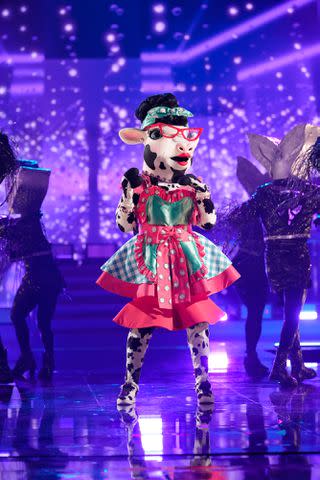 <p>Michael Becker/FOX</p> NE-YO performing as Cow on 'The Masked Singer' season 10.