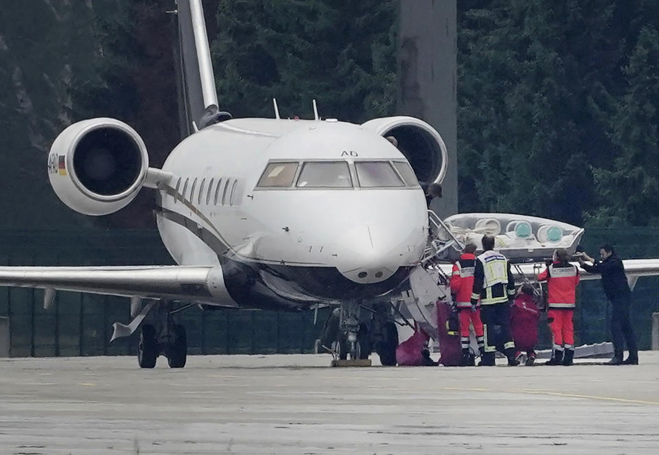 FILE-In this Aug. 22, 2020 file photo a stretcher is taken from special aircraft with the Kremlin critic Alexei Navalny on board at Tegel Airport in Berlin. Germany is increasing pressure on Russia over the poisoning of Russian opposition politician Alexei Navalny, warning that a lack of support by Moscow in the investigation could “force” Germany to rethink the fate of a German-Russian pipeline project. ( Michael Kappeler/dpa via AP)