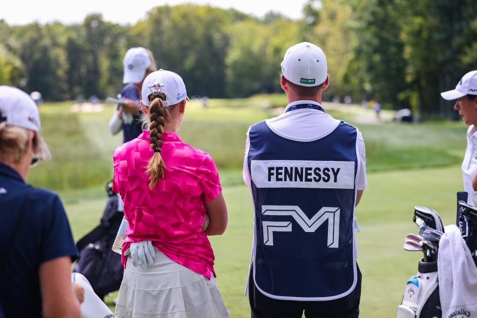 Dover High School senior Carys Fennessy with her father/caddy/coach Matt Fennessy wait for introductions before the second round of the LPGA's FM Global Championship at TPC Boston Friday, Aug. 30, 2024 in Norton, Massachusetts.