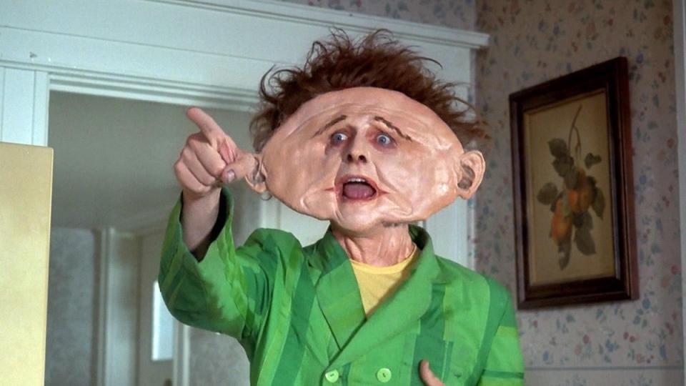 Rik Mayall as Drop Dead Fred with a hideously exaggerated squashed face.