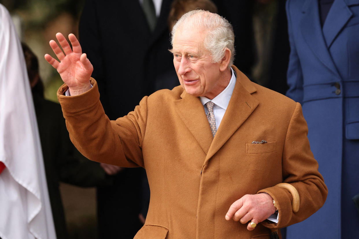 Britain's King Charles III waves to well-wishers after attending the Royal Family's traditional Christmas Day service at St Mary Magdalene Church on the Sandringham Estate in eastern England, on December 25, 2023. (Photo by Adrian DENNIS / AFP)