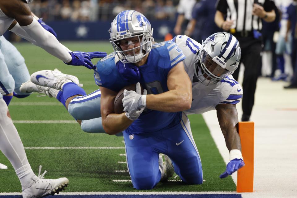 Lions tight end Brock Wright is tackled at the 1-yard line by Cowboys linebacker Micah Parsons during the second half of the Lions' 24-6 loss to the Cowboys on Sunday, Oct. 23, 2022, in Arlington, Texas.